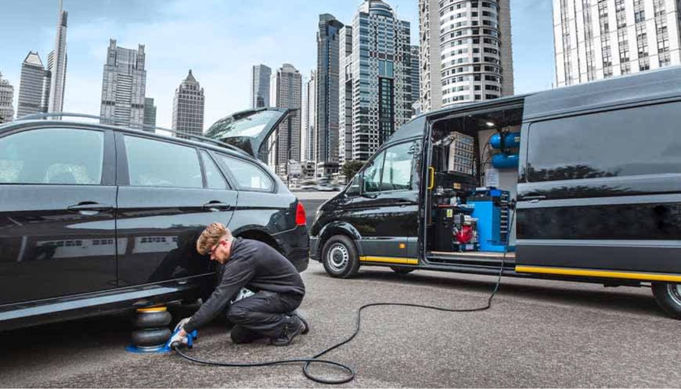 Mechanic servicing a vehicle in city